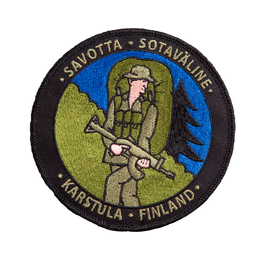 Circular patch with a soldier holding a rifle on a forest hill with the texts