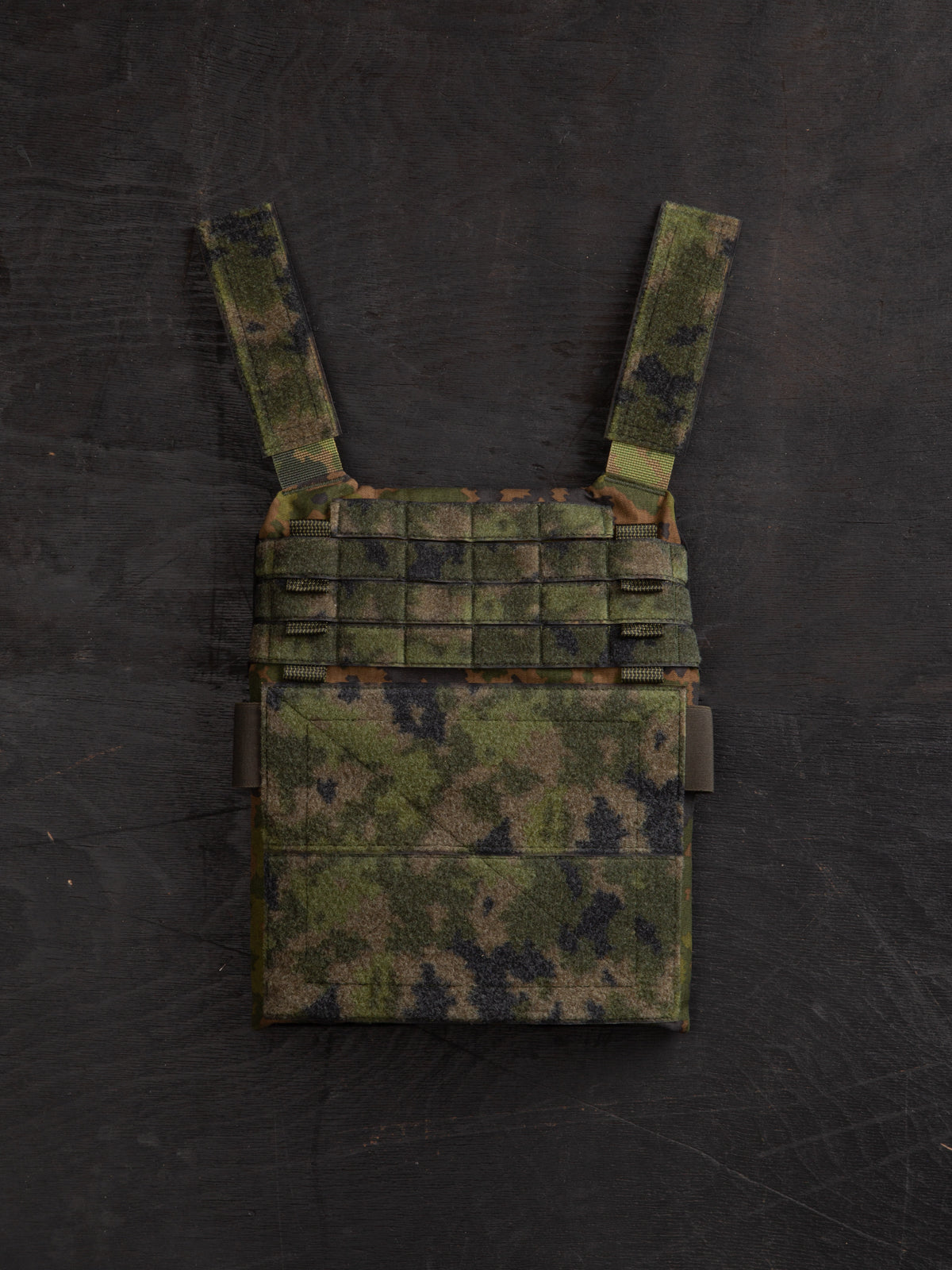 Savotta plate carrier front piece on a dark wooden surface