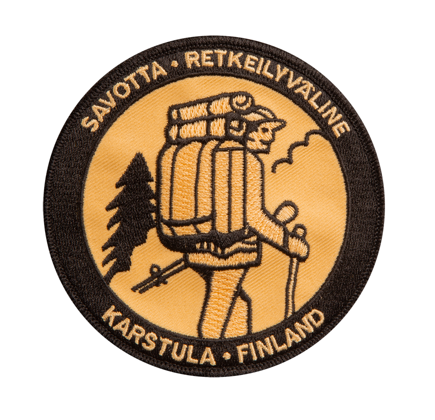 Circular patch with a hiker and backpack design, featuring text 'Savotta Retkeilyvaline Karstula Finland' on a white background.