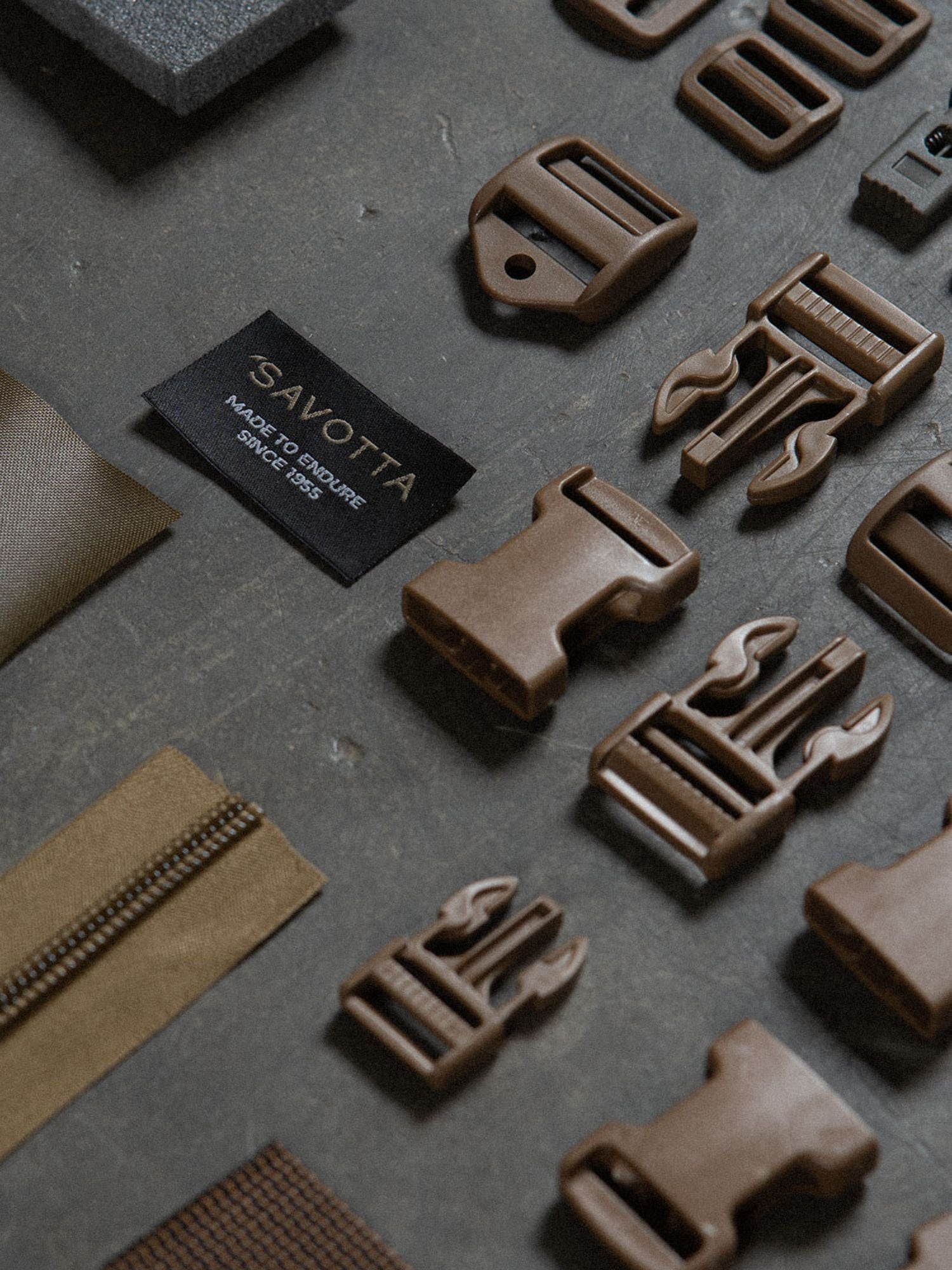 Savotta spare parts on a dark wooden surface