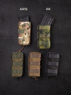 Five differently colored (Multicam, M05 woodland, green, brown and black) Savotta AR15-AK mag pouches on a dark background, labeled for AR15 and AK