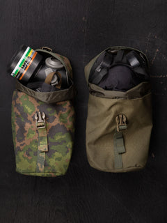 Two Savotta Lidded GP pouches 4x5 on a dark surface, both containing a gas mask.
