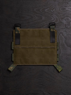 Savotta Varjelus PALS placard from the back on a dark wooden surface