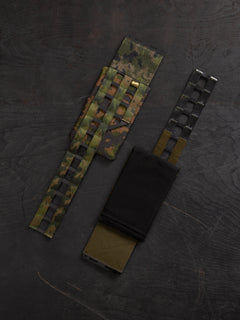 Savotta Varjelus plate carrier cummerbund with Varjelus side armour bags attached, photographed from the front and the back.