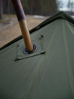Close-up of the roof of Savotta Hawu 8 tent with the stove chimney and steel stove jack piece